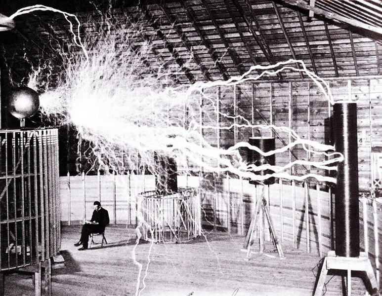 Nikola Tesla testing Tesla coil indoors